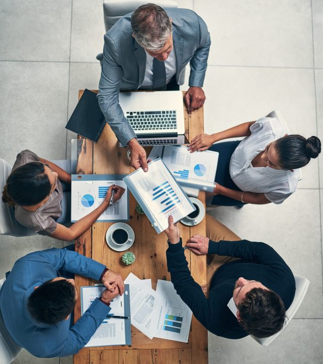 High angle shot of a group of businesspeople having a meeting in an office.